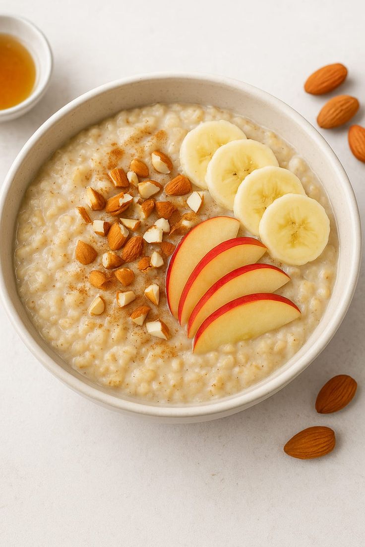 Oat porridge with banana, apple slices and almonds